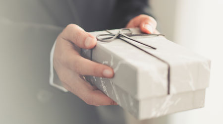 hands holding a wrapped gift